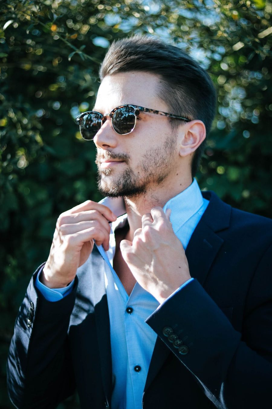 Bearded man outdoors with a styled grown-out beard in natural light