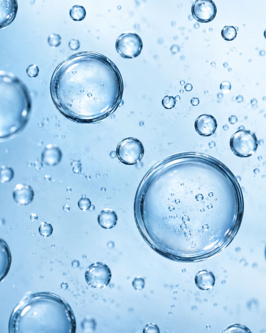Macro view of a clear peptide solution representing copper-peptide research context for beard support